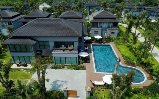 Aerial view of luxury beachfront villas in Phuket, representing high-value property investments.