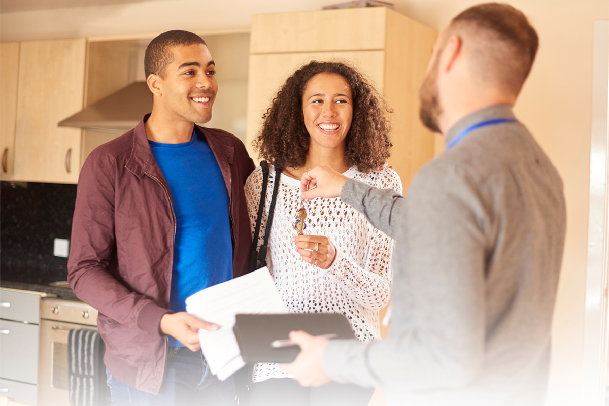 A professional property manager shaking hands with a satisfied tenant